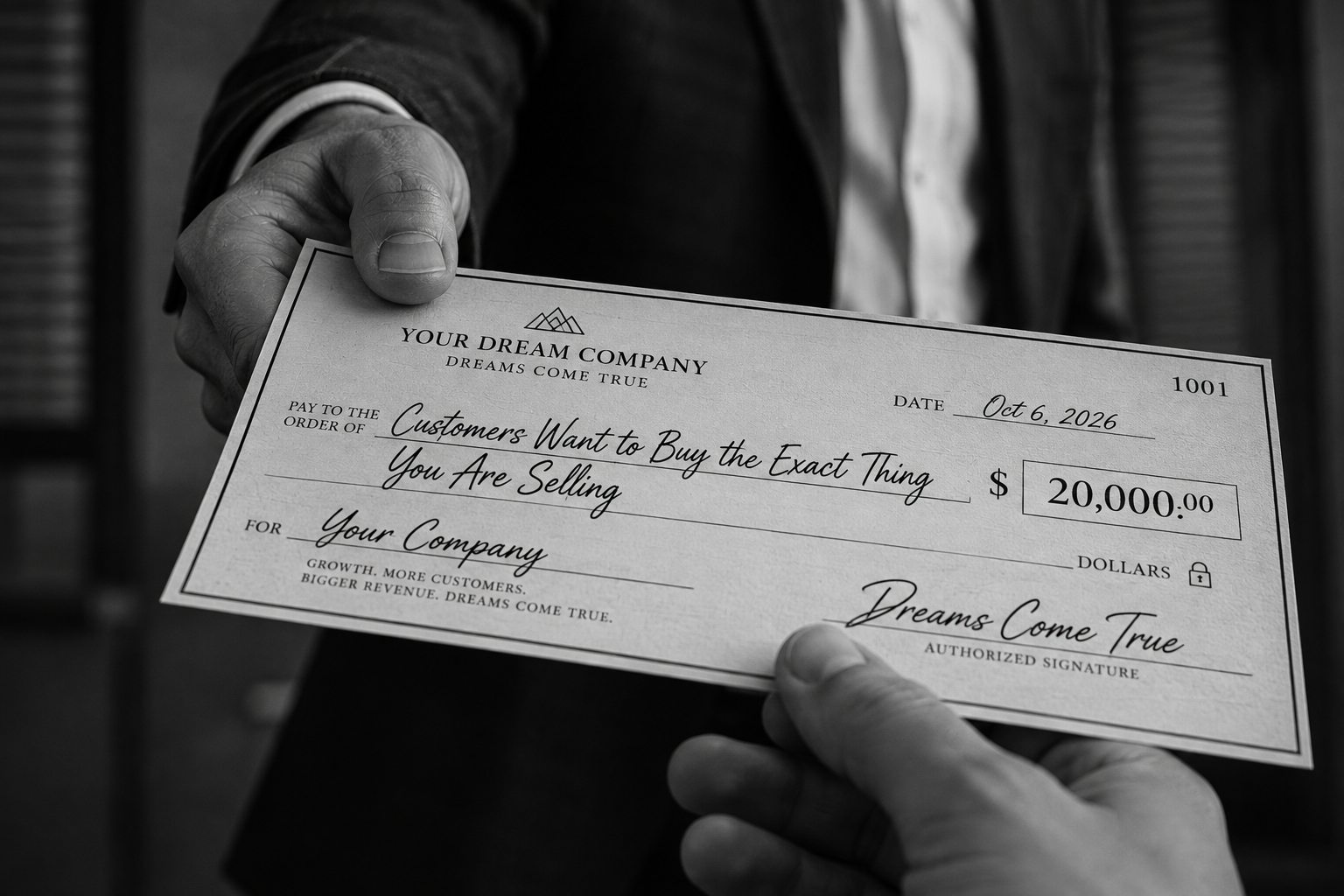 Client receiving a growth check — 9 figures of growth